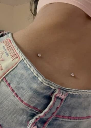 Lower Back Dermal Piercing